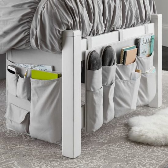 Hanging dorm bed grey canvas storage organizer with pockets.