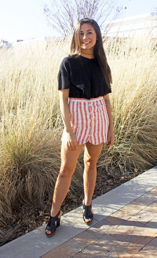 Fashion on campus at the University of Texas at Arlington. Brittany wears a striped scalloped mini skirt, a baggy black tee, a cute choker and black wedges.