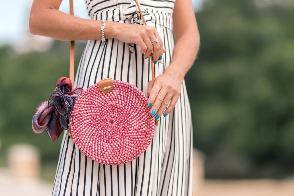 How to create your own unique wardrobe - photo of a woman with circle bag and blue nails