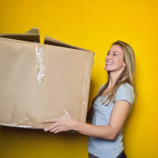 What not to bring to college - girl holding a box