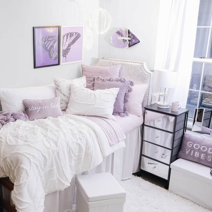 Purple and white dorm room from Dormify