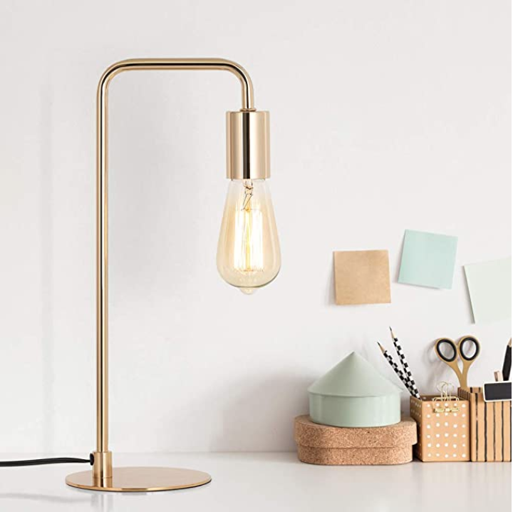 Gold desk lamp with exposed edison bulb