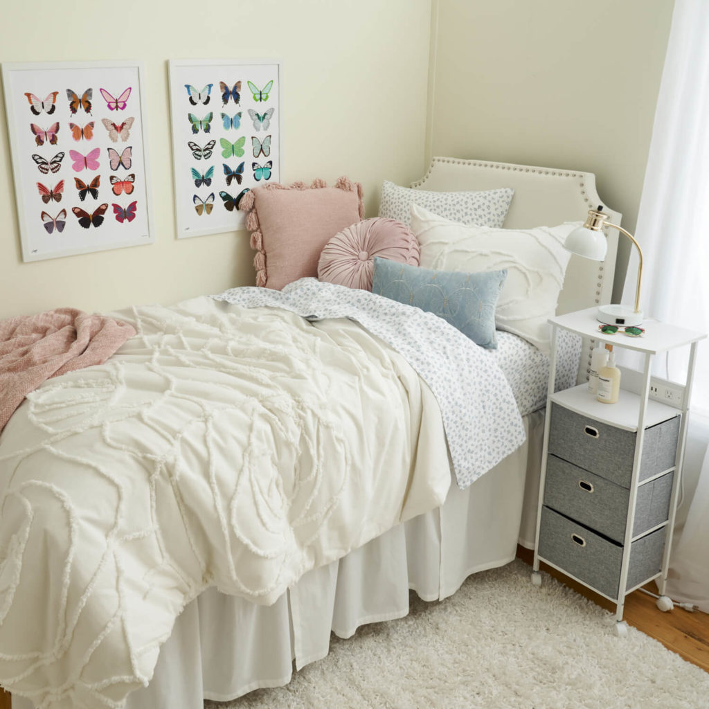 Dreamy dorm room with pink and blue offset by cream